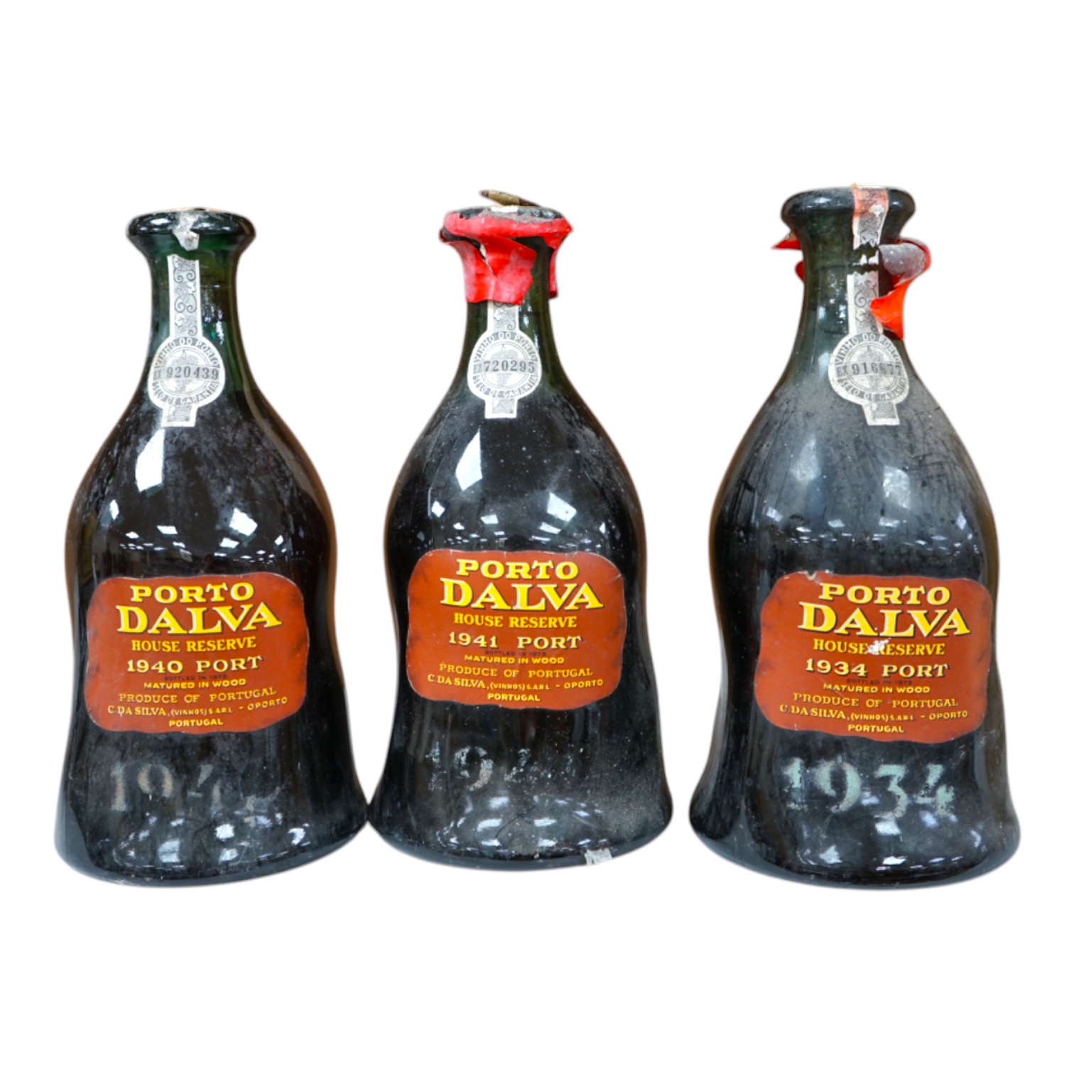 Three bottles of Porto Dalva house reserve port, comprising; 1934, 1940 and 1941. Condition - fair, some wear to labels and seals, etc.